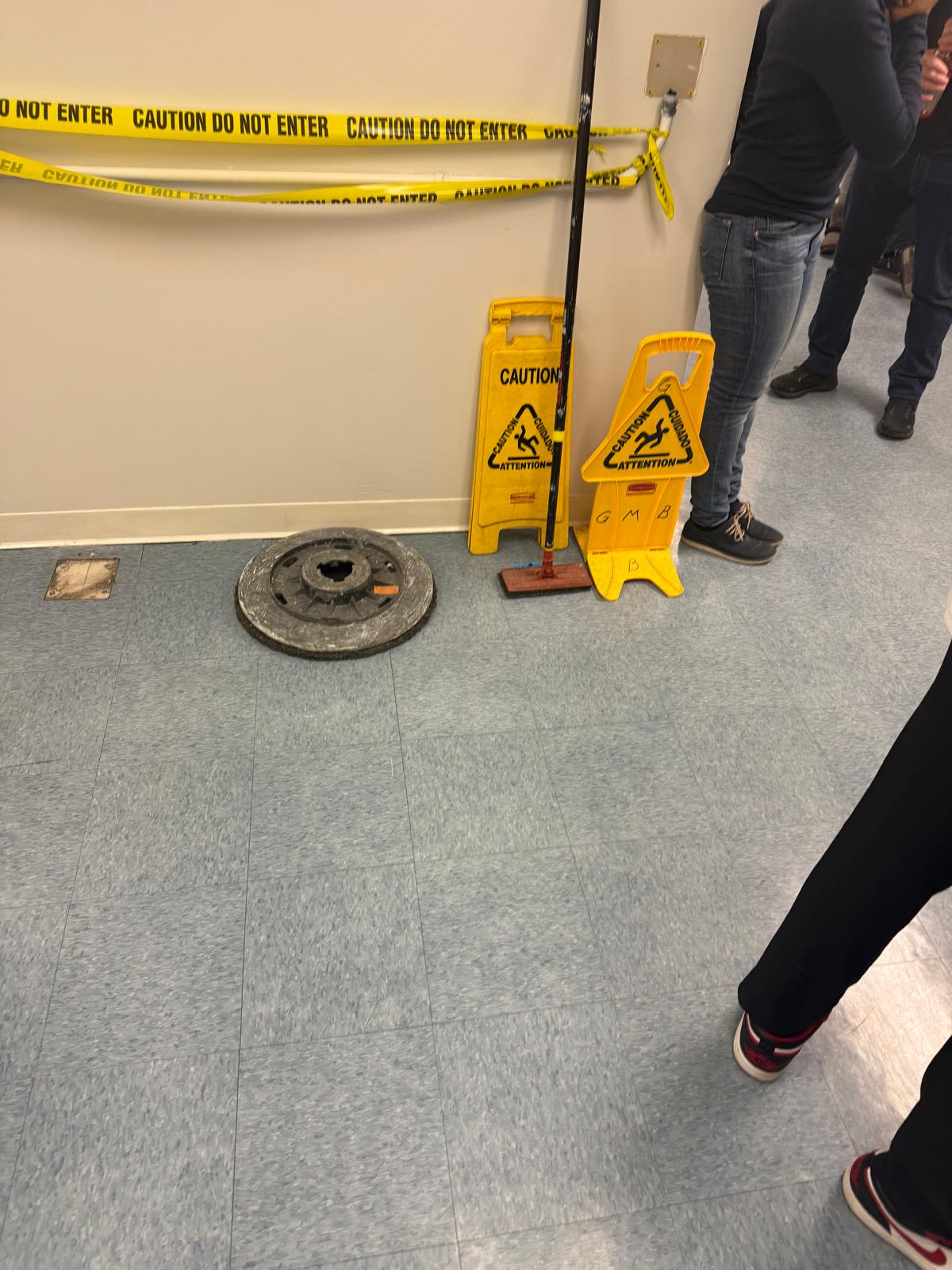Professional floor cleaning equipment and safety signs